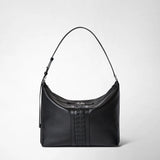 Frontal view: ANI SHOULDER BAG IN CACHEMIRE LEATHER AND MOSAICO features a black shoulder bag with a central Mosaico leather detail and an adjustable strap.