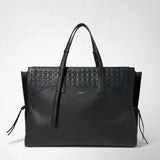 Frontal view: MAXI MARO BAG IN CACHEMIRE LEATHER AND MOSAICO — black, large tote bag with an embossed Mosaico panel on top, side leather knots, two handles; visible 'SERAPIAN' embossing.