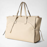 Front view: MAXI MARO BAG IN CACHEMIRE LEATHER AND MOSAICO shows a cream-colored, roomy tote made of grained Cachemire leather with a Mosaico panel, long handles and side leather knots against a neutral background; visible lettering: SERAPIAN MILANO.
