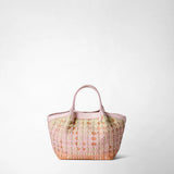 Front view: MINI SECRET BAG IN MOSAICO MESTIERI D'ARTE displays braided Bokashi-pink leather with a soft color gradient and two short handles, standing against a light, neutral background.