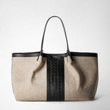 Frontal view: SECRET TOTE BAG IN WOOL AND MOSAICO features a large beige wool tote with black leather handles, trim, and a central black Mosaico woven leather panel. 'SERAPIAN MILANO' is embossed at the top center.