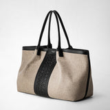 Three-quarter frontal view: SECRET TOTE BAG IN WOOL AND MOSAICO features a beige wool tote with black leather handles and a central black Mosaico leather panel.