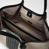 Detail view: SECRET TOTE BAG IN WOOL AND MOSAICO shows the interior of an open tote bag with suede lining, zippered and slip pockets, and leather trim.