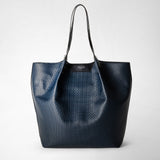 Front view of the VERTICAL SECRET TOTE BAG IN STEPAN in ocean blue Stepan-coated linen with black leather handles and subtle textured embossing.