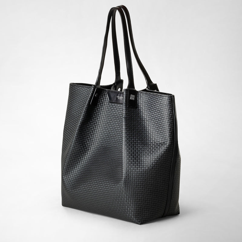 Oblique front view of the VERTICAL SECRET TOTE BAG IN STEPAN, made from textured asphalt gray Stepan-coated canvas with black leather handles.